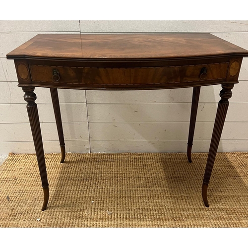 43 - A Regency style mahogany side table on tapering out swept legs (H74cm W82cm D47cm)