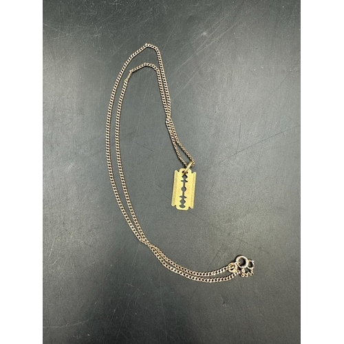 448 - An 18ct gold razor blade pendant on a 9ct gold necklace (1.7ct and 4.3ct)