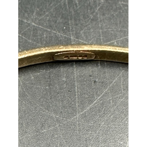 449 - A 9ct gold bangle, approximate weight 18.7g