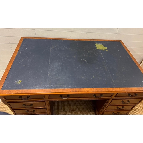 46 - A Pedestal desk with leather top on bracket feet