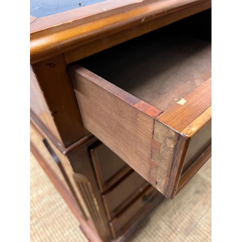 46 - A Pedestal desk with leather top on bracket feet