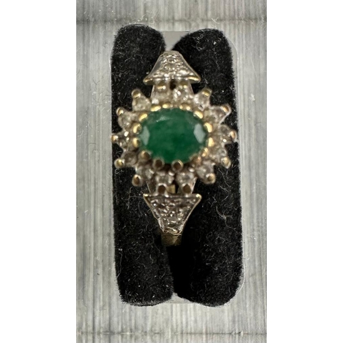 462 - A 9ct gold ring with central emerald. Approximate Total weight 2.1g size N