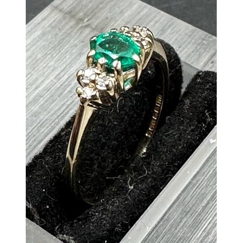 471 - A 9ct gold ring with emerald and diamonds size M