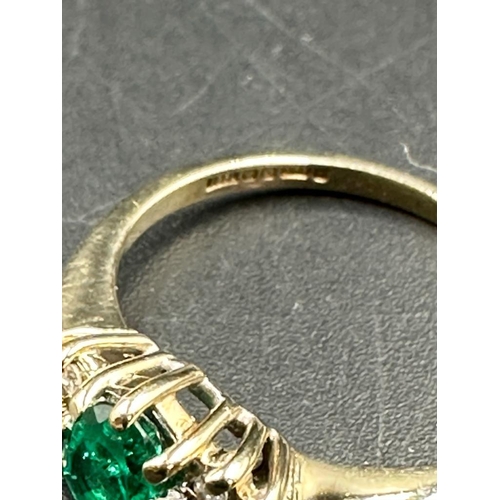 471 - A 9ct gold ring with emerald and diamonds size M