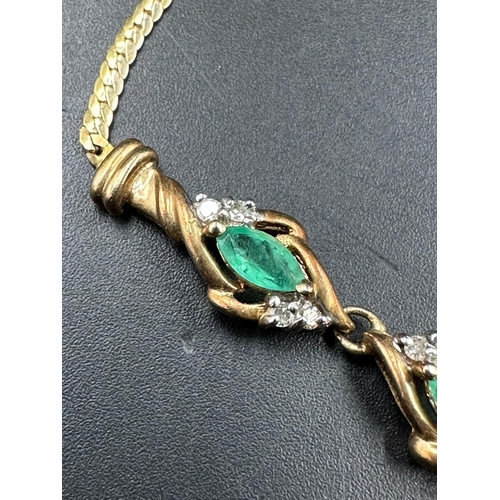 478 - A 14ct gold necklace, hallmarked for Italy and with diamond and emerald style stones. (Approximate t... 