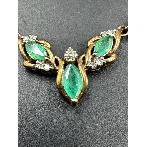 478 - A 14ct gold necklace, hallmarked for Italy and with diamond and emerald style stones. (Approximate t... 