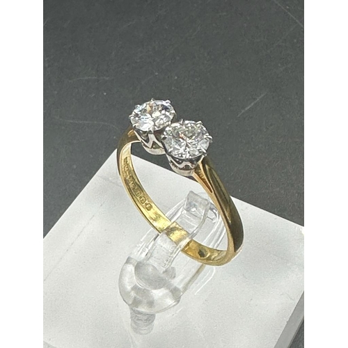 484 - A double diamond engagement ring on yellow gold, marked 750.