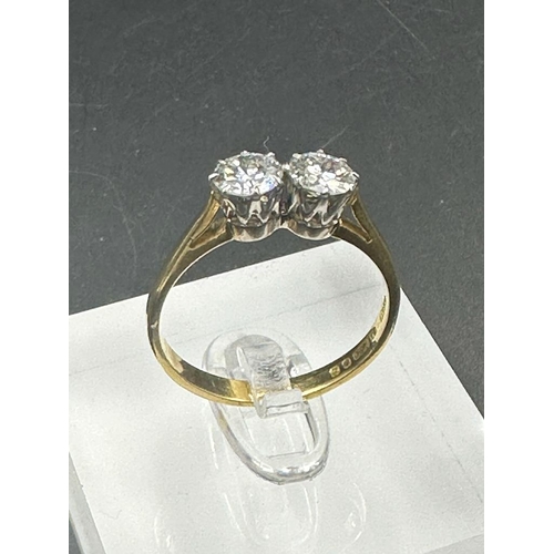 484 - A double diamond engagement ring on yellow gold, marked 750.