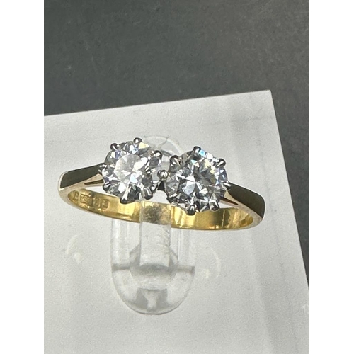 484 - A double diamond engagement ring on yellow gold, marked 750.