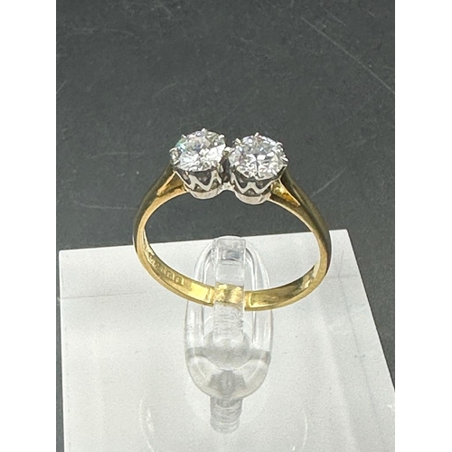 484 - A double diamond engagement ring on yellow gold, marked 750.