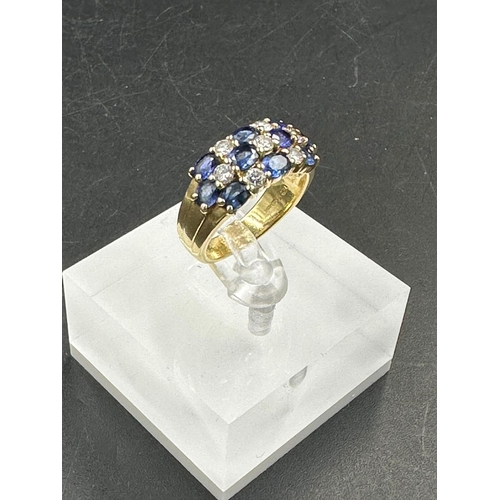 485 - A sapphire and diamond chequerboard ring on 18ct gold mount, marked 750