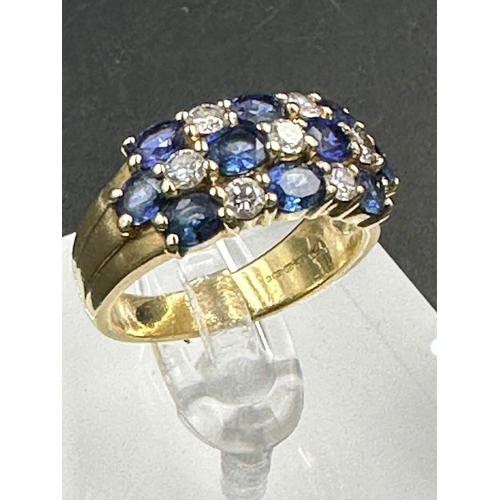 485 - A sapphire and diamond chequerboard ring on 18ct gold mount, marked 750