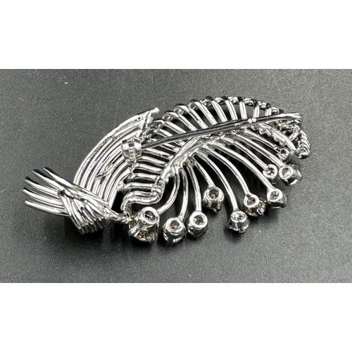 486 - A white gold diamond spray brooch with a beautiful array of quality diamonds.