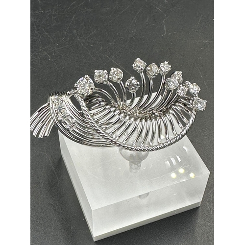 486 - A white gold diamond spray brooch with a beautiful array of quality diamonds.