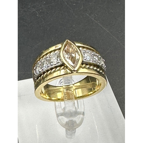 488 - A yellow gold diamond ring with central stone and three separate diamonds to each side .