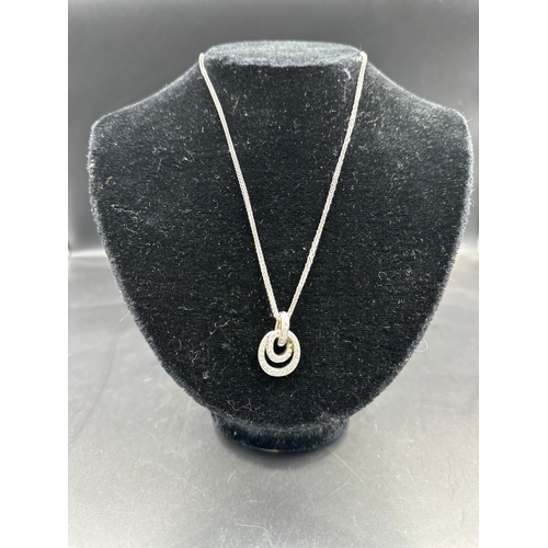 489 - An 18ct white gold diamond pendant on 18ct white necklace