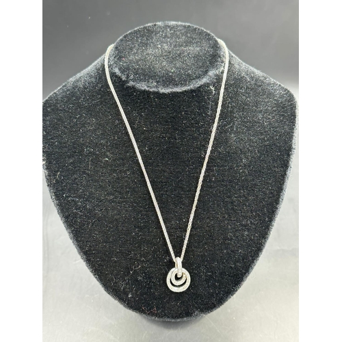 489 - An 18ct white gold diamond pendant on 18ct white necklace