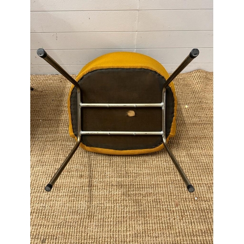 49 - A pair of Mid Century mustard upholstered arm chairs on chrome legs