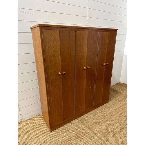 51 - A Mid Century teak Clerical cabinet comprising of three cupboards and multiple shelves (H128cm W118c... 