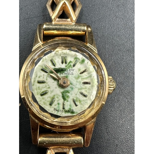 517 - An 18ct gold ladies wristwatch on a 9ct gold bracelet