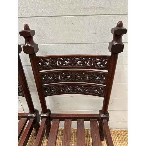 54 - Two hard wood carved Wedding chairs with pierced backs on block feet