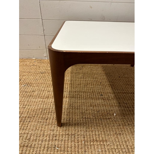 55 - A contemporary square coffee table with Formica top on mahogany frame (H36cm W60cm D60cm)