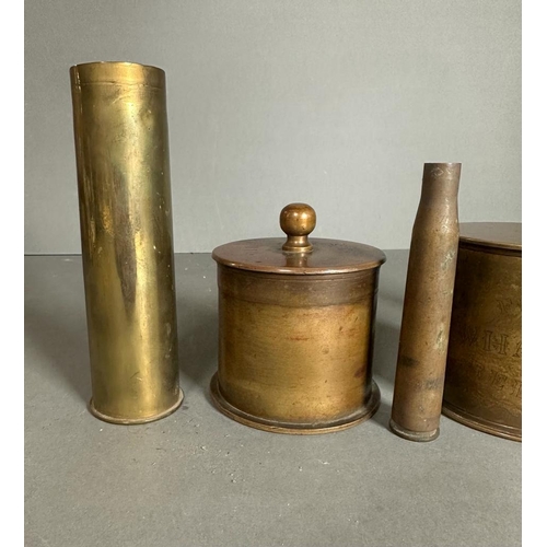 550 - A selection of trench art to include tobacco jars etc.