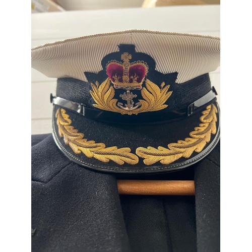 555 - A Royal naval mess dress jacket and naval uniform jacket along with cap