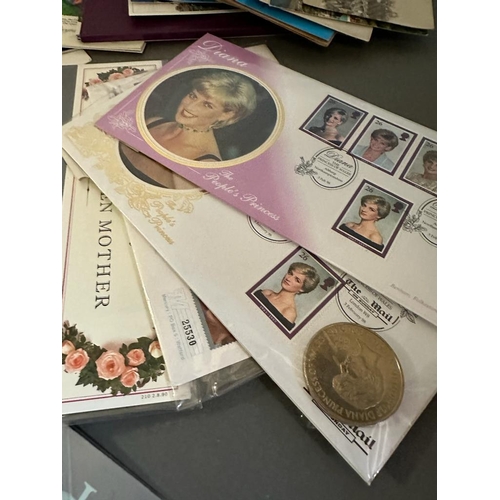 572 - A selection of collectable stamp packs, coin covers and postcards.