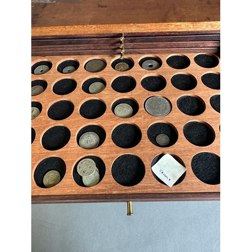 581 - A coin collectors cabinet containing a large selection of Great British coins along with worldwide c... 