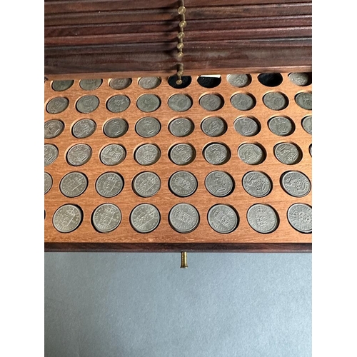 581 - A coin collectors cabinet containing a large selection of Great British coins along with worldwide c... 