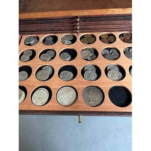 581 - A coin collectors cabinet containing a large selection of Great British coins along with worldwide c... 