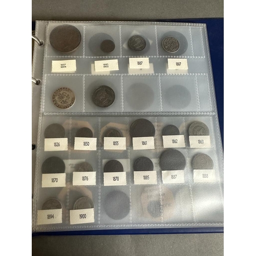 583 - A coin album with a variety of worldwide coins including, Great Britain, America, Germany and India.