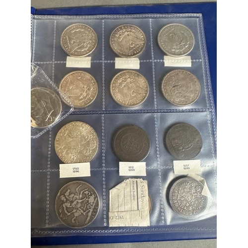 583 - A coin album with a variety of worldwide coins including, Great Britain, America, Germany and India.