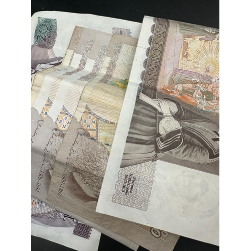 586 - A selection of out of circulation bank notes from the United Kingdom, one £20, eight £10 notes, five... 