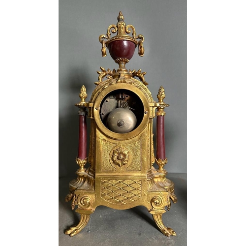 595 - A French eight day hand painted enamel faced mantel clock with garniture