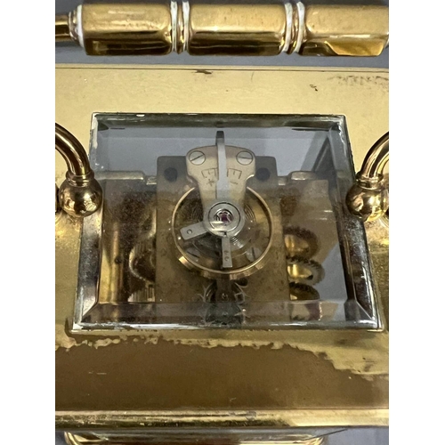 604 - Asprey brass eight day carriage clock with key