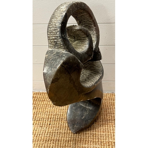 619 - A polished stone African stylised sculpture (78cm H x 40cm W)