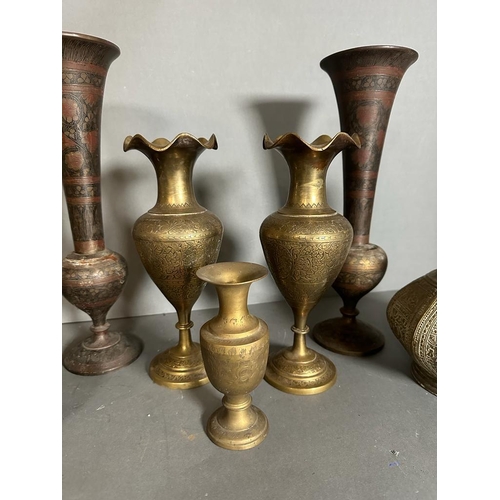 642 - A selection of seven Persian copper and brass vases