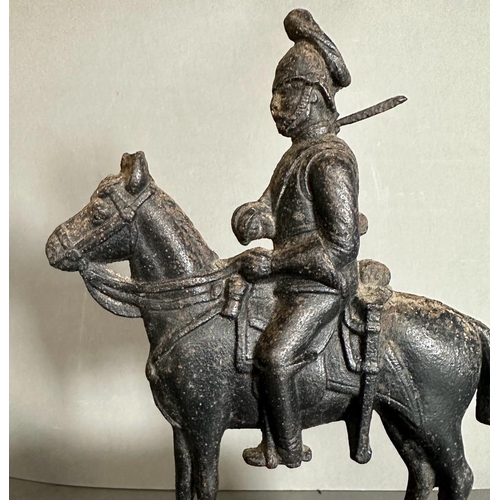 644 - A cast iron doorstop of a military figure