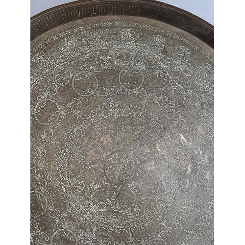 645 - A Persian brass Tea Table top engraved.