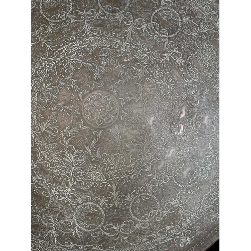 645 - A Persian brass Tea Table top engraved.