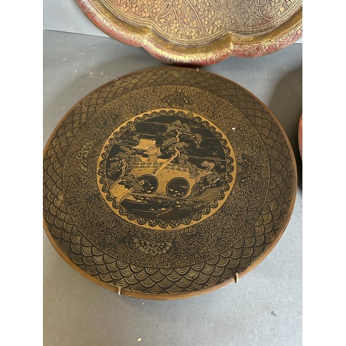 646 - A selection of six Persian and Oriental brass and copper trays.