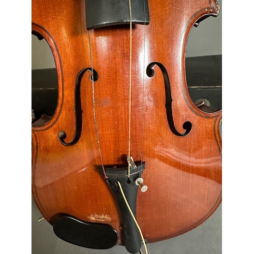 648 - A violin and bow made in Saxony, case AF bow and violin in need of new strings and hair.