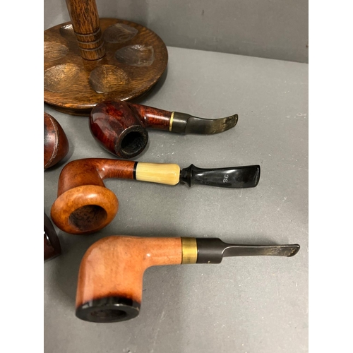 652 - Eight pipes various makers and a Dunhill oak pip stand