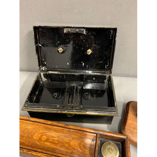 655 - A metal cashbox and a wooden desk pen holder with inkwells to end and a brass letter scales with wei... 