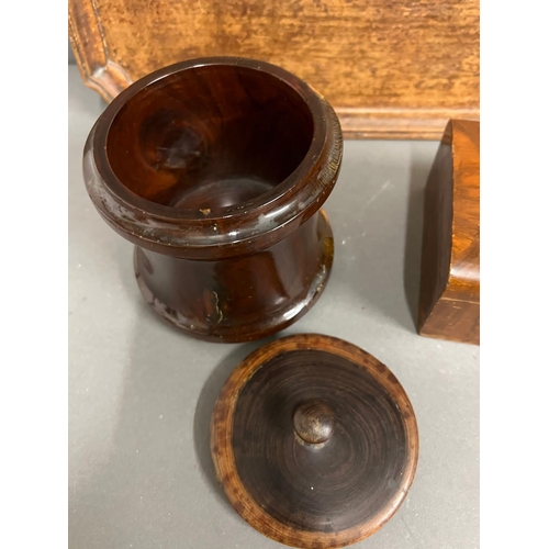 657 - A wooden tray with scrolling corners, wooden cigarette box and a tobacco lidded storage jar