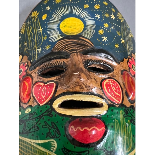 663 - A clay hand painted Mexican wall hanging mask (25cm)