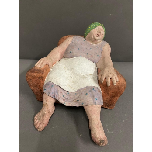 667 - A Clay sculpture of a Housewife unsigned