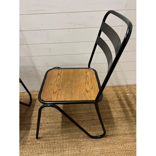 67 - A pair of contemporary industrial style sacking chairs with wooden seat and metal hair pin style fra... 